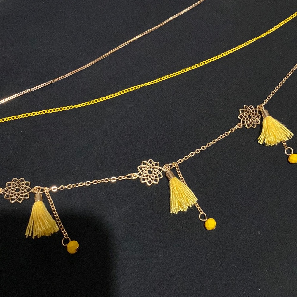 Earring, bracelet, and necklace set in yellow